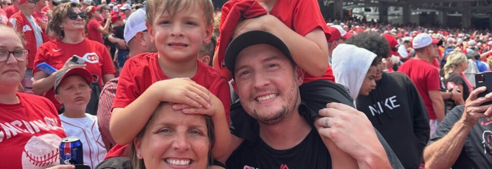 Kyle Wilson and his family at a Cincinnati Reds baseball game.